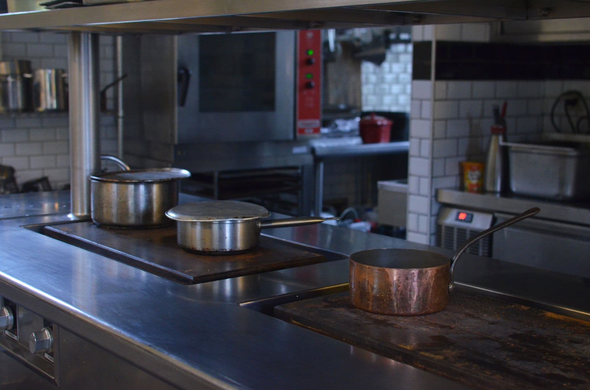 Clean and organized stainless steel surfaces in a commercial kitchen